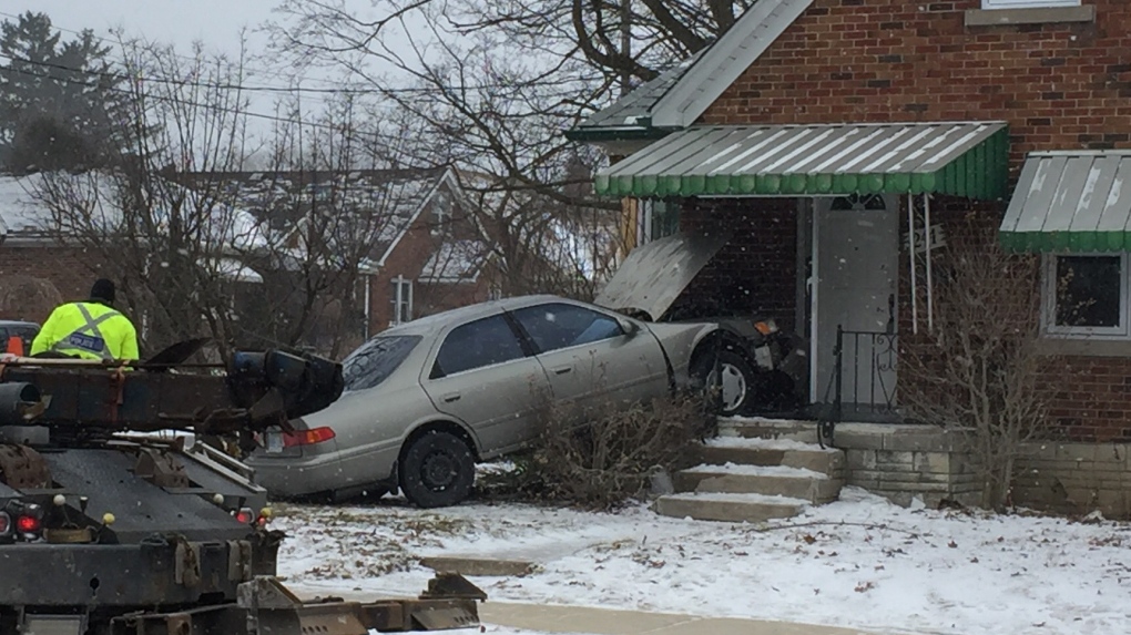 A vehicle after crashing into the front of a house