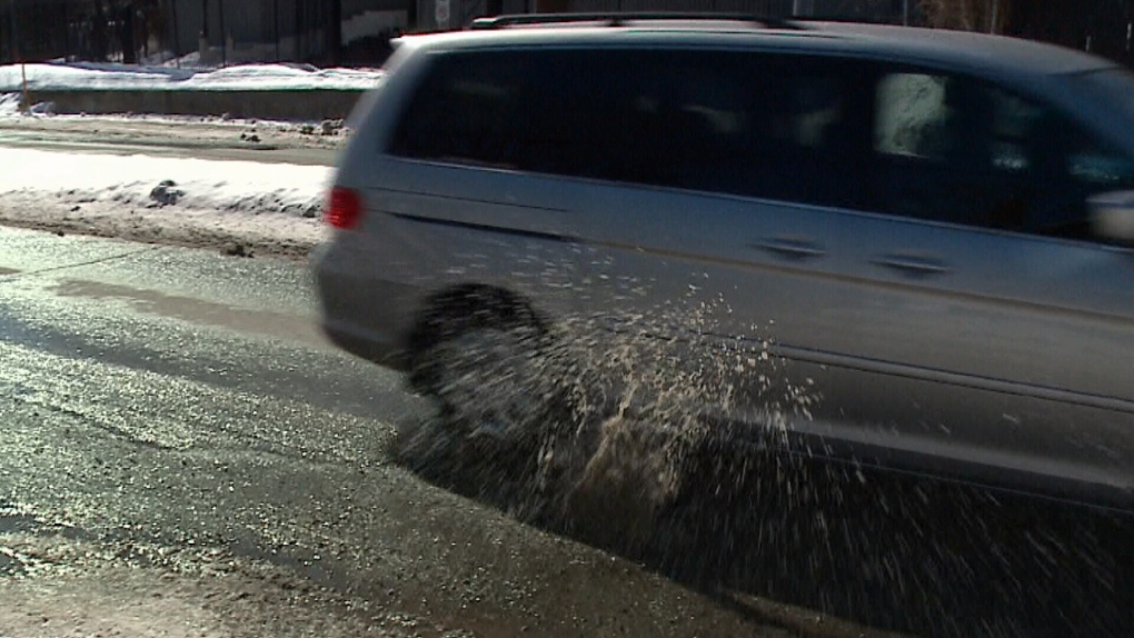Vehicle hits pothole in Ottawa.