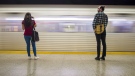 Commuters wait to take the subway at Ossington Station in Toronto on Friday, June 22, 2018. THE CANADIAN PRESS/ Tijana Martin