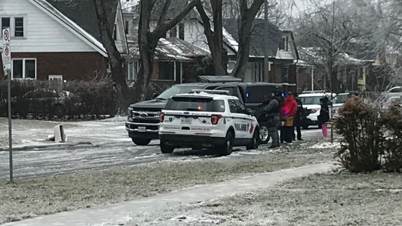 Windsor police have guns drawn at a weapons call at the corner of Seminole and Arthur in Windsor, Ont., on Tuesday, Feb. 12, 2019. (Rich Garton / CTV Windsor)