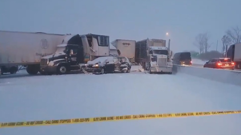 Multiple vehicles await tows after a fatal pile-up on Highway 401 in Ingersoll, Ont. on Wednesday, Feb. 13, 2019. (@OPP_WR / Twitter)
