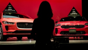 The electric powered Jaguar I-Pace (left) and the Kia Stinger were awarded 2019 Utility Vehicle and Car of the Year by the Automobile Journalists Association of Canada during an event at the Canadian International Auto Show in Toronto on Thursday, February 14, 2019. (The Canadian Press / Christopher Katsarov)
