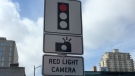 A sign for a red-light camera is seen in London, Ont. on Tuesday, Feb. 19, 2019. (Bryan Bicknell / CTV London)
