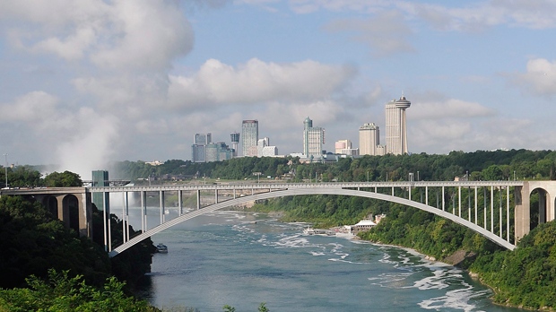 This Aug. 7, 2014 photo, shows the Rainbow Bridge which connects Niagara Falls, New York and Niagara Falls, Ontario, Canada. Three Afghanistan National Army officers who went missing during a training exercise at a Cape Cod military base were detained Monday, Sept. 22, 2014, at the U.S.-Canadian border, Massachusetts law enforcement officials said.  (AP Photo/The Niagara Gazette, Dan Cappellazzo) 
