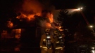 More than 25 firefighters from Oyster River and Campbell River battled the blaze, which was quickly consuming the structure on Friday, March 1, 2019. (CTV Vancouver Island)