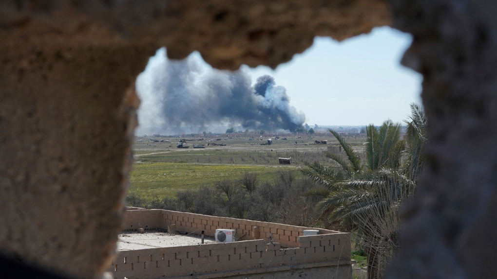 Columns of black smoke billow in Syria