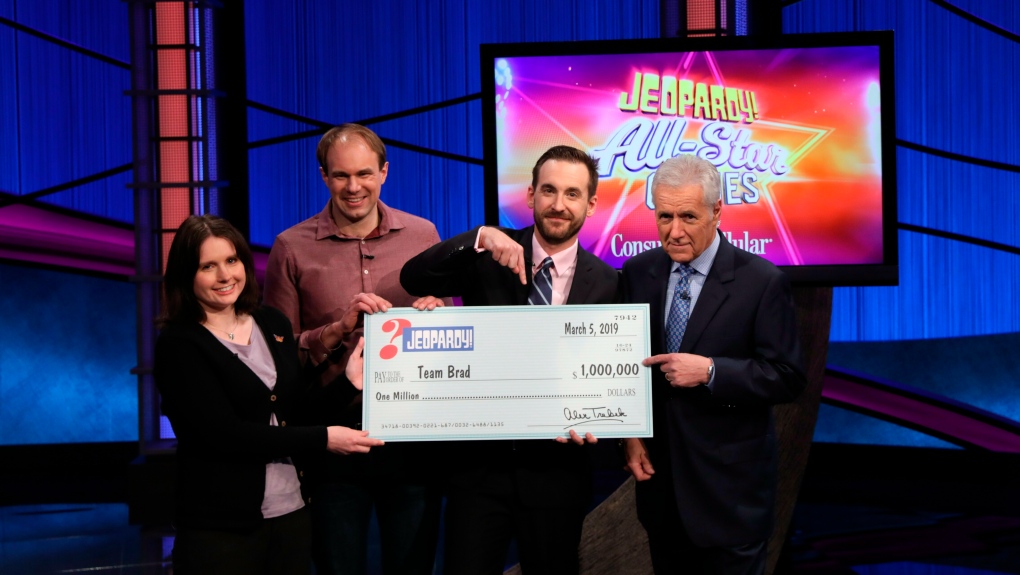 Jeopardy team champions with Alex Trebek