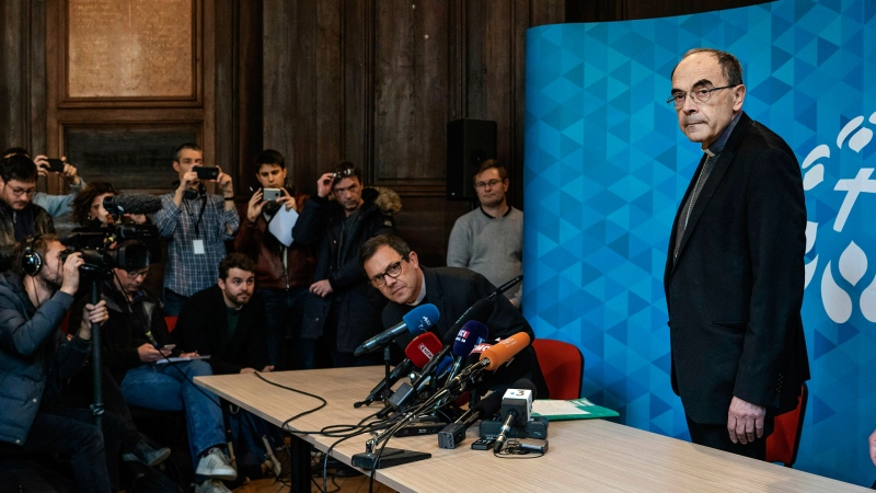French Cardinal Philippe Barbarin, right, arrives for a press conference in Lyon, central France, Thursday, March 7, 2019. (AP / Laurent Cipriani)