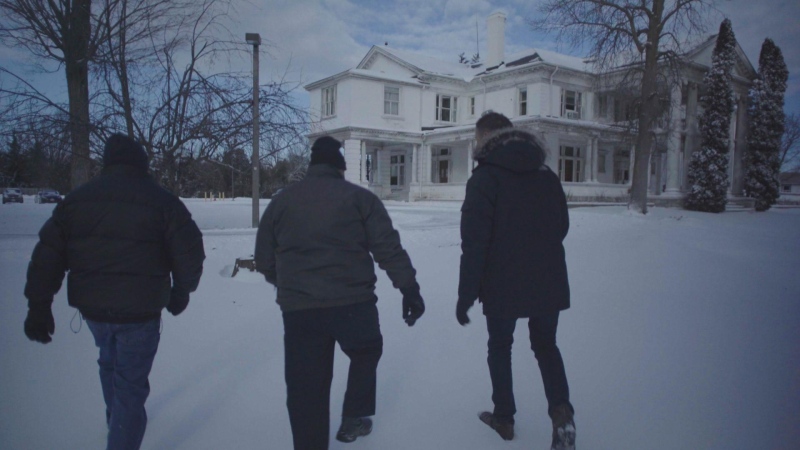 From left: Training school abuse survivors Phil Mynott and Rick Brown, and W5's Peter Akman, walk towards the former grounds of Brookside Training School in Cobourg, Ont. (W5)