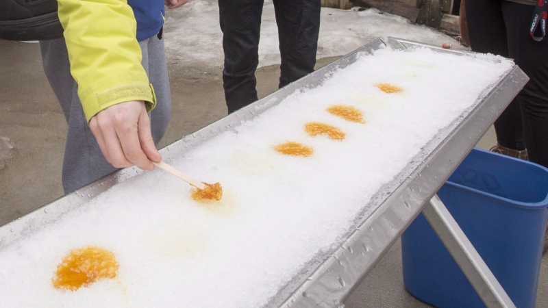 People sample some hot maple syrup on snow, Thursday, March 10, 2016 in Saint Marc-sur Richilieu, Que.THE CANADIAN PRESS/Ryan Remiorz