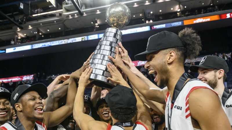 Members of the Carleton Ravens celebrate winning the USports men's basketball national championship over the University of Calgary Dinos in Halifax on Sunday, March 10, 2019. THE CANADIAN PRESS/Darren Calabrese
