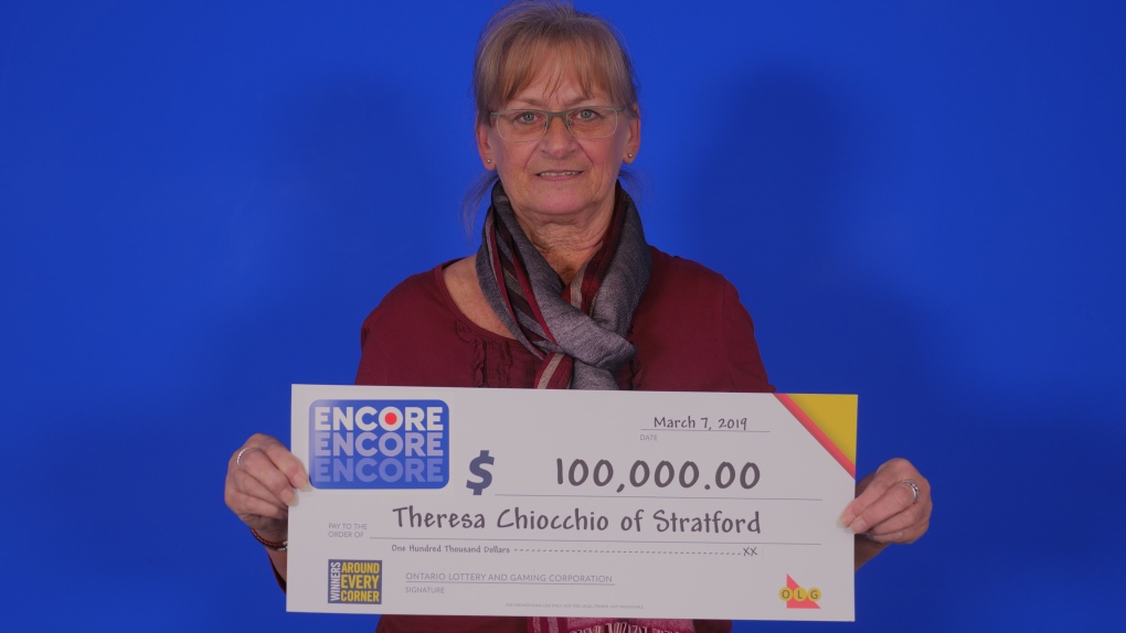 A woman with a $100,000 cheque