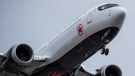 An Air Canada Boeing 737 Max aircraft arriving from Toronto prepares to land at Vancouver International Airport in Richmond, B.C., on March 12, 2019. THE CANADIAN PRESS/Darryl Dyck