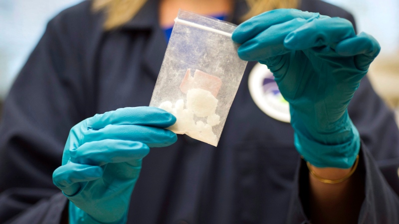 In this Aug. 9, 2016, file photo, a bag of 4-fluoro isobutyryl fentanyl seized in a drug raid is displayed at the Drug Enforcement Administration (DEA) Special Testing and Research Laboratory in Sterling, Va. (AP Photo/Cliff Owen)