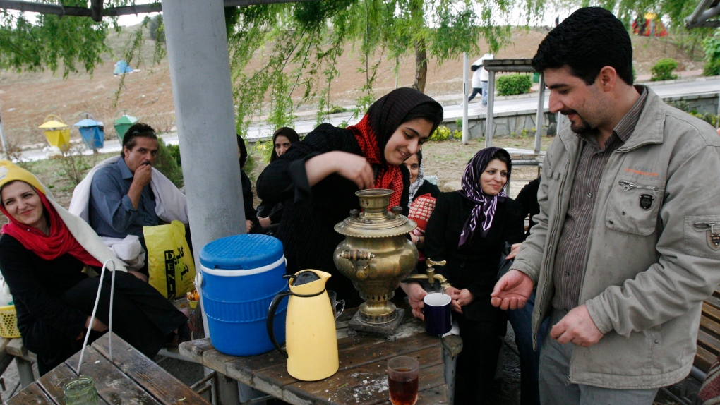Iranian woman prepares tea