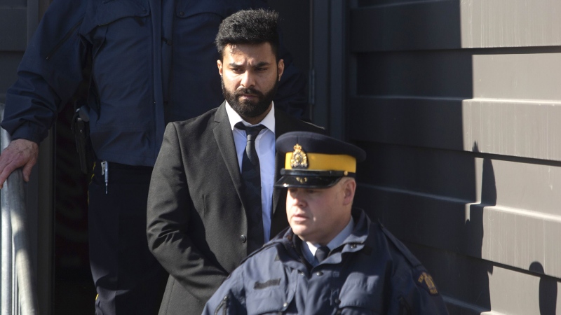 Jaskirat Singh Sidhu is taken out of the Kerry Vickar Centre by the RCMP following his sentencing for the Humboldt Broncos bus crash in Melfort, Sask., on Friday, March, 22, 2019. THE CANADIAN PRESS/Kayle Neis