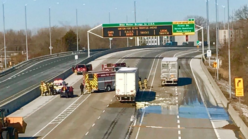 A collision involving two transport trucks led to a spill on Highway 402 in Sarnia, Ont. on Monday, April 1, 2019. (@SarniaFire / Twitter)