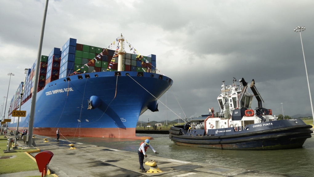 A Panama Canal worker docks a Chinese ship