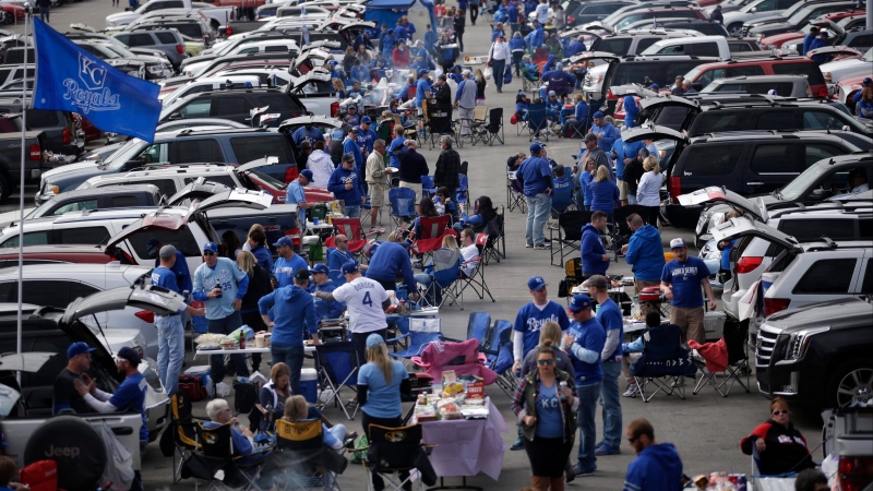 Fans tailgate before Game 2 of baseball's American League Championship Series between the Kansas City Royals and the Toronto Blue Jays on Saturday, Oct. 17, 2015, in Kansas City, Mo. (AP Photo/Jae C. Hong)