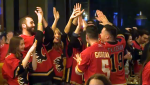 Flames fans celebrate a 4 - 0 win over the Colorado Avalanche on Wednesday night.
