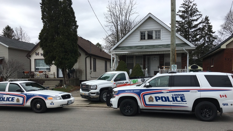 Cruisers surround a home where a man was found dead on Burbrook Place in London, Ont. on Monday, April 15, 2019. (Brent Lale / CTV London)