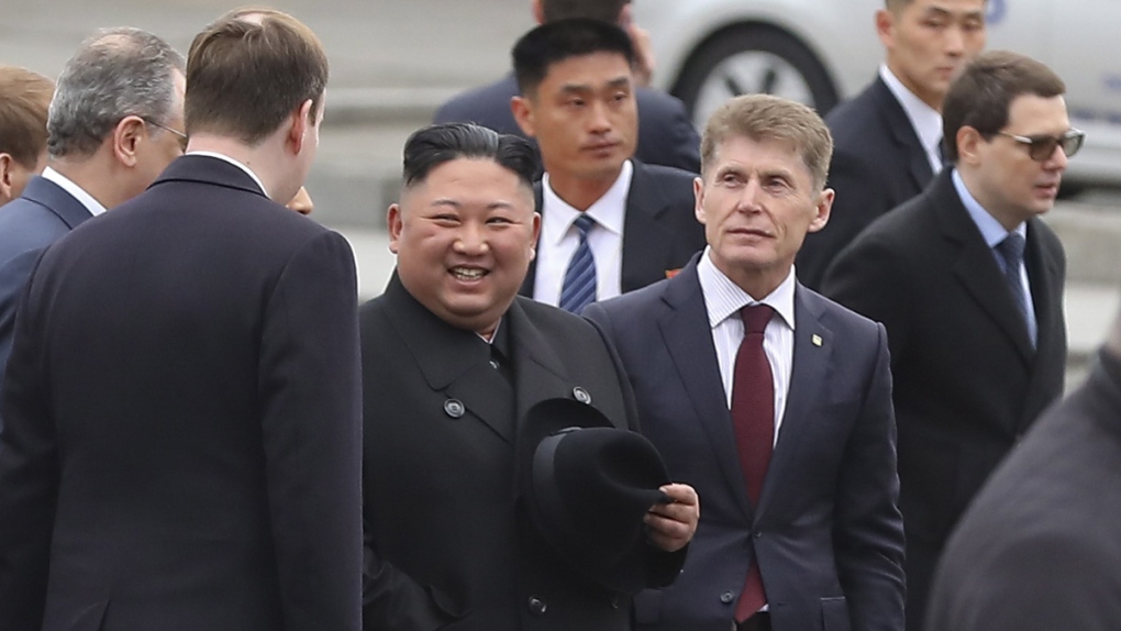 North Korea's leader Kim Jong Un, centre left