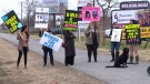 Parents protest outside MacLeod's Ottawa office.