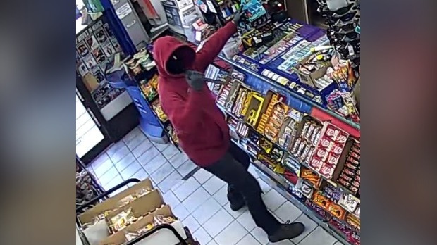 A man holding a weapon at a convenience store