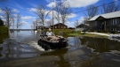 A resident makes his way along Morin Road though floodwaters from the Ottawa River in Cumberland, Ontario on Tuesday, April 30, 2019. THE CANADIAN PRESS/Sean Kilpatrick