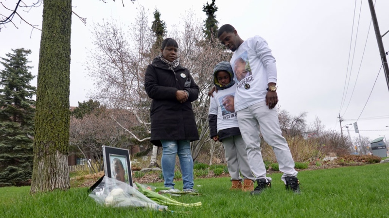 Clemee Joseph and two of her children stand near the bus stop where her 18-year-old son was fatally shot 10 years ago. 