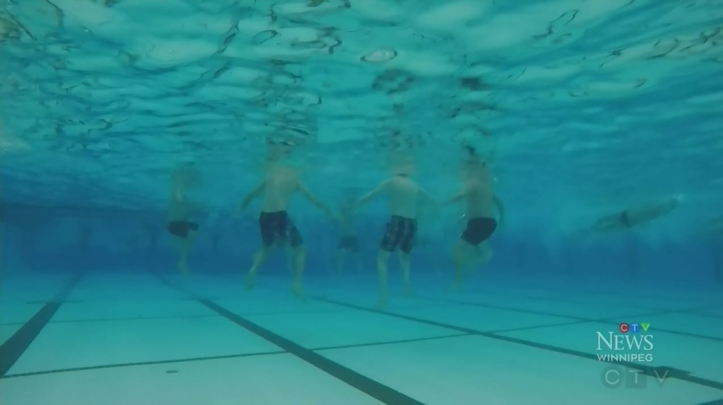 Dads band together to form synchronized swim team