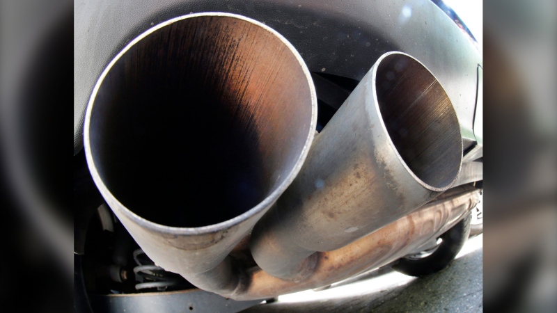 The exhaust pipes of a VW Diesel car are photographed in Frankfurt, Germany, Wednesday, Aug. 2, 2017. (AP Photo/Michael Probst) 