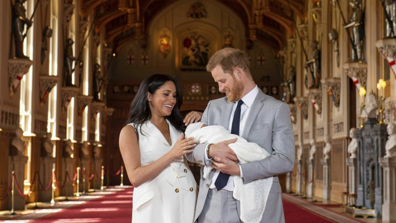 Prince Harry and Meghan, Duchess of Sussex, during a photocall with their newborn son, in St George's Hall at Windsor Castle, Windsor, on May 8, 2019. (Dominic Lipinski/Pool via AP)