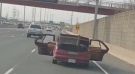 Police have laid charges against a Hamilton man who police allege was spotted driving down the QEW with metal sticking out of the car's open rear doors. (Twitter/ OPP Sgt. Kerry Schmidt)