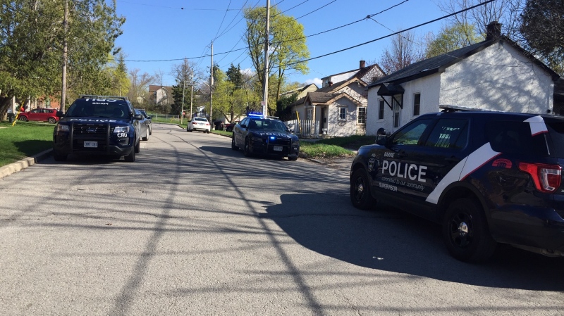 Barrie police units are parked along Berczy Street in Barrie responding to a weapons call on Wed., May 15, 2019 (CTV News/Steve Mansbridge)