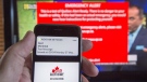 A smartphone and a television receive visual and audio alerts to test Alert Ready, a national public alert system, in Montreal on Monday, May 7, 2018.(THE CANADIAN PRESS/Ryan Remiorz)