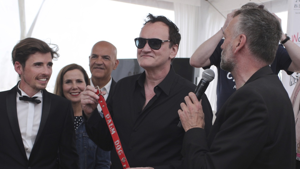 Tarantino with the Palm Dog collar award