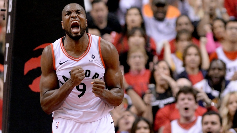 Toronto Raptors centre Serge Ibaka (9) reacts after dunking the ball during first half NBA Eastern Conference finals action against the Milwaukee Bucks, in Toronto on Saturday, May 25, 2019. (THE CANADIAN PRESS/Nathan Denette)