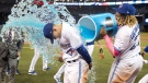 Toronto Blue Jays Cavan Biggio gets a Gatorade shower from teammate Vladimir Guerrero Jr. during a post-game interview after the Jays defeated the San Diego Padres 10-1 in their interleague MLB baseball game in Toronto, Sunday, May 26, 2019. (THE CANADIAN PRESS/Fred Thornhill)