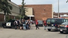 CPS units and students outside of Lord Beaverbrook High School on Thursday afternoon following an investigation into a suspicious person that resulted in an arrest