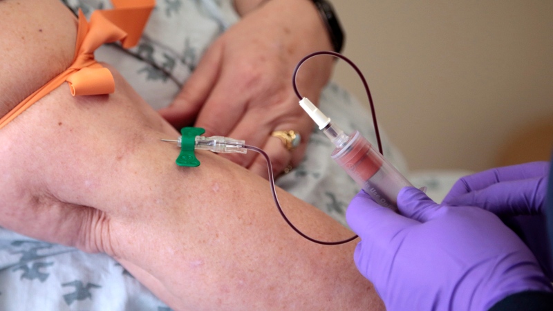 In this Tuesday, April 28, 2015 file photo, a patient has her blood drawn at a hospital in Philadelphia to monitor her cancer treatment. (AP Photo/Jacqueline Larma, File)