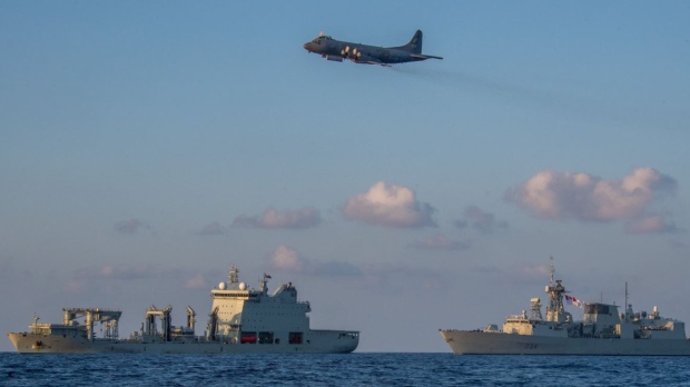 HMCS Regina and Asterix supply ship Image