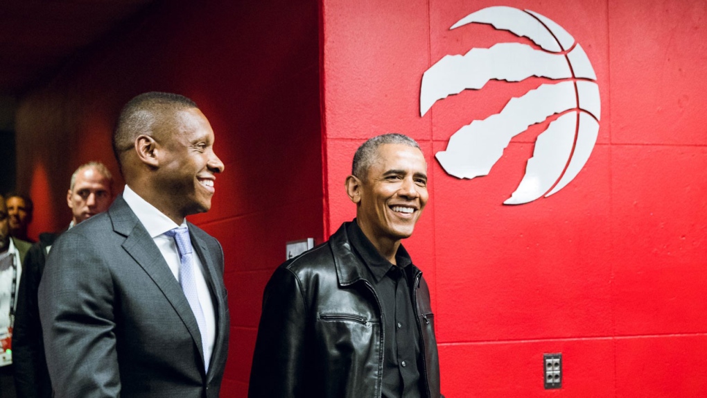 Toronto Raptors general manager Masai Ujiri, left, and rapper