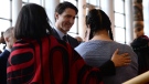 Prime Minister Justin Trudeau greets the opening procession as they take the stage at the closing ceremony for the National Inquiry into Missing and Murdered Indigenous Women and Girls in Gatineau, Que., on Monday, June 3, 2019. (THE CANADIAN PRESS / Adrian Wyld)