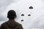 French and British parachutists jump during a commemorative parachute jump over Sannerville, Normandy, Wednesday, June 5, 2019. (AP Photo/Thibault Camus)