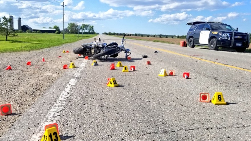 OPP investigate after a fatal collision involving a motorcycle north of Arthur, Ont. on Thursday, June 6, 2019. (@OPP_WR / Twitter)
