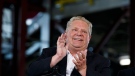Ontario Premier Doug Ford applauds during an announcement in the the mock-up facility at the Darlington Power Complex, in Bowmanville, Ont., Friday, May 31, 2019. THE CANADIAN PRESS/Cole Burston
