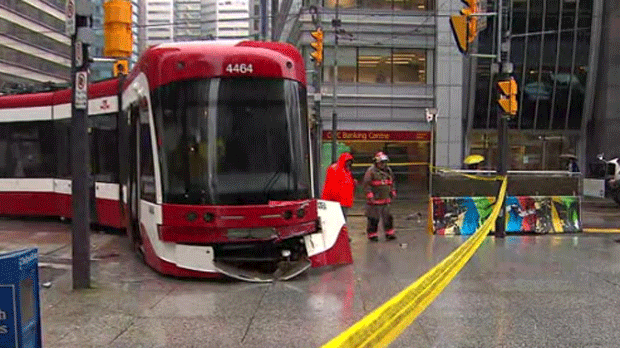 A derailed streetcar is shown on a sidewalk near University Avenue and King Street on Monday morning. 