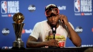 Toronto Raptors forward Kawhi Leonard speaks at a news conference alongside the NBA Finals Most Valuable Player trophy after the Raptors defeated the Golden State Warriors in Game 6 of basketball's NBA Finals in Oakland, Calif., Thursday, June 13, 2019. (AP Photo/Ben Margot)