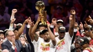 Toronto Raptors forward Kawhi Leonard, centre, holds Larry O'Brien NBA Championship Trophy after defeating the Golden State Warriors basketball action in Game 6 of the NBA Finals in Oakland, Calif. on Thursday, June 13, 2019. Raptors have won their first NBA title in franchise history. THE CANADIAN PRESS/Frank Gunn